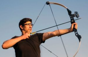 man holding a compound bow